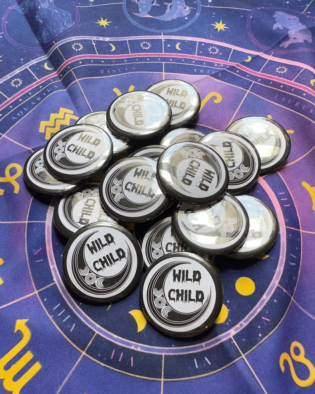 badges labeled 'Wild Child' on a astrological chart