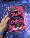 Book titled 'Calm in the Chaos' by Lizz Mears held against a starry night sky background.